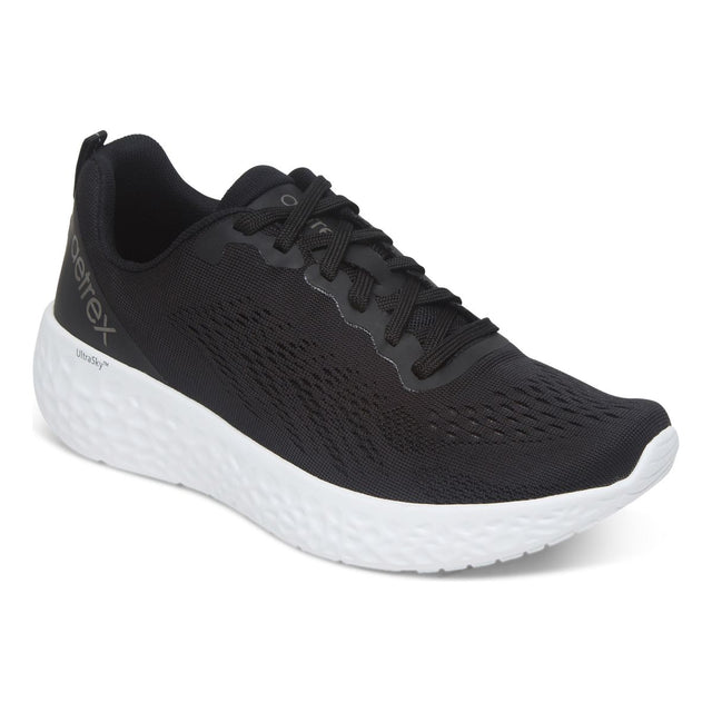 Front and side views of the Aetrex Danika Black Wide sneaker featuring breathable black mesh upper, padded collar, and durable rubber outsole with traction pods.