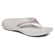 White Aetrex Fiji Sparkle sandal showing soft toe post, contoured arch support, and lightweight textured sole suitable for water use.