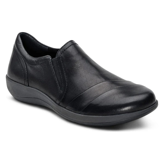 Aetrex black leather slip-on shoe with pleated vamp detail, dual elastic gores, and supportive rubber sole. Style #DM570W.