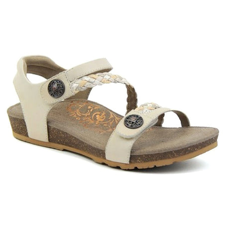 Ivory leather sandal with two wide adjustable hook-and-loop straps across the foot and a padded heel strap, featuring a contoured footbed with visible arch support and a low-profile cork and rubber sole.