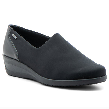 Women’s black waterproof slip‑on wedge with stretch fabric and hydro‑nappa leather upper, rounded toe, and roomy fit. Features a GORE‑TEX® membrane, cushioned removable insole, and flexible rubber sole for stylish, comfortable all‑weather wear. Style #406119-06