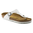 A white Birkenstock Gizeh Birko-Flor sandal with a contoured cork-latex footbed and a Birko-Flor upper material, showing the side profile with the brand name visible.