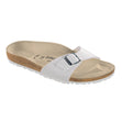 A white Birkenstock Madrid Birko-Flor sandal with an adjustable strap and cork-latex footbed.