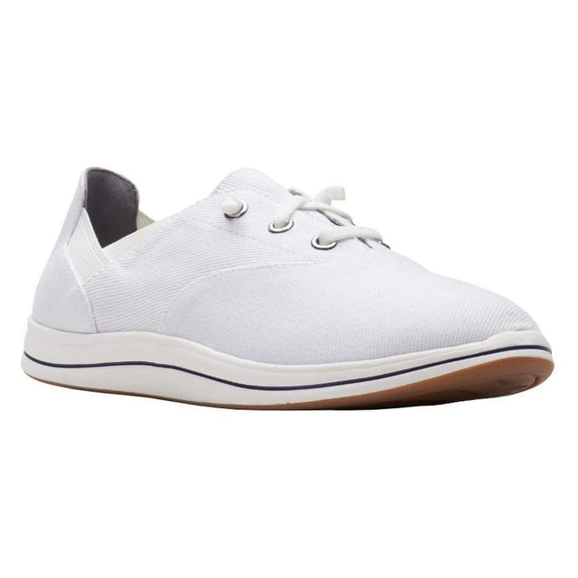 Women's white canvas lace-up walking shoe with a white midsole and a brown rubber outsole. Style #26165264.