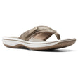 Women’s taupe thong sandal with an adjustable hook-and-loop strap, white midsole, and cushioned footbed. Style #26125507