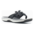 Clarks Brinkley Flora women’s thong sandal in black with floral strap detail with white cushioned soles. Style #26159867