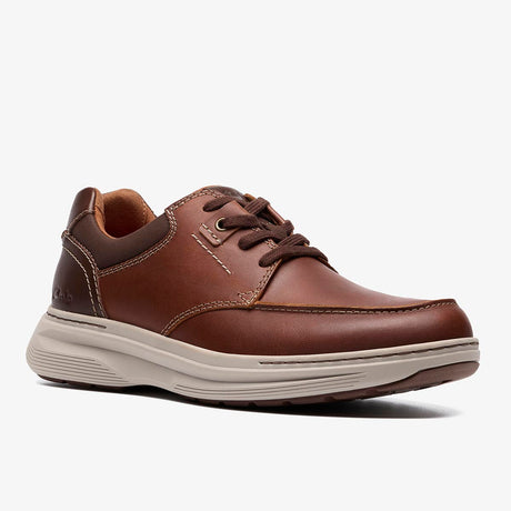 Clarks Craftwell Lace tan leather shoe with contrast stitching, elastic laces, and a thick, light-colored EVA sole. Style: 26184710