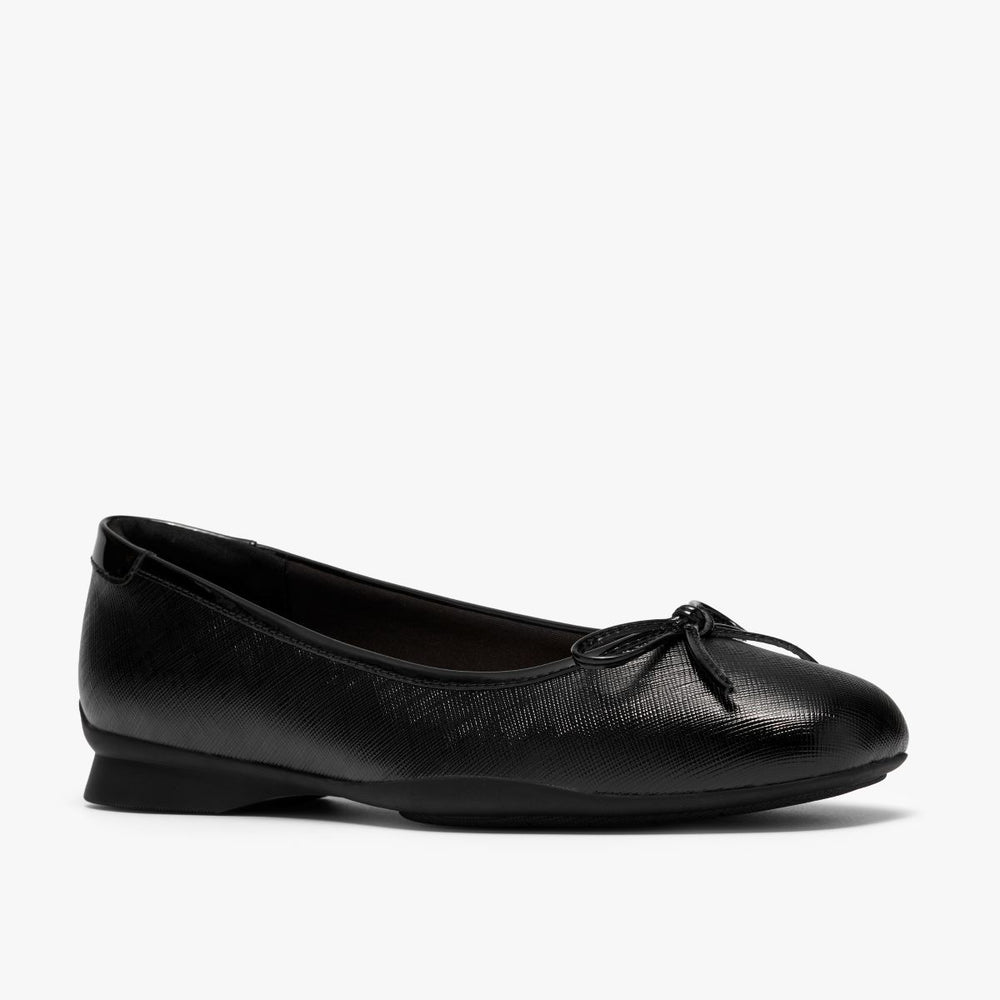 Black textured leather ballet flat with delicate bow detail, flexible sole, and low mini heel. Style #26328312