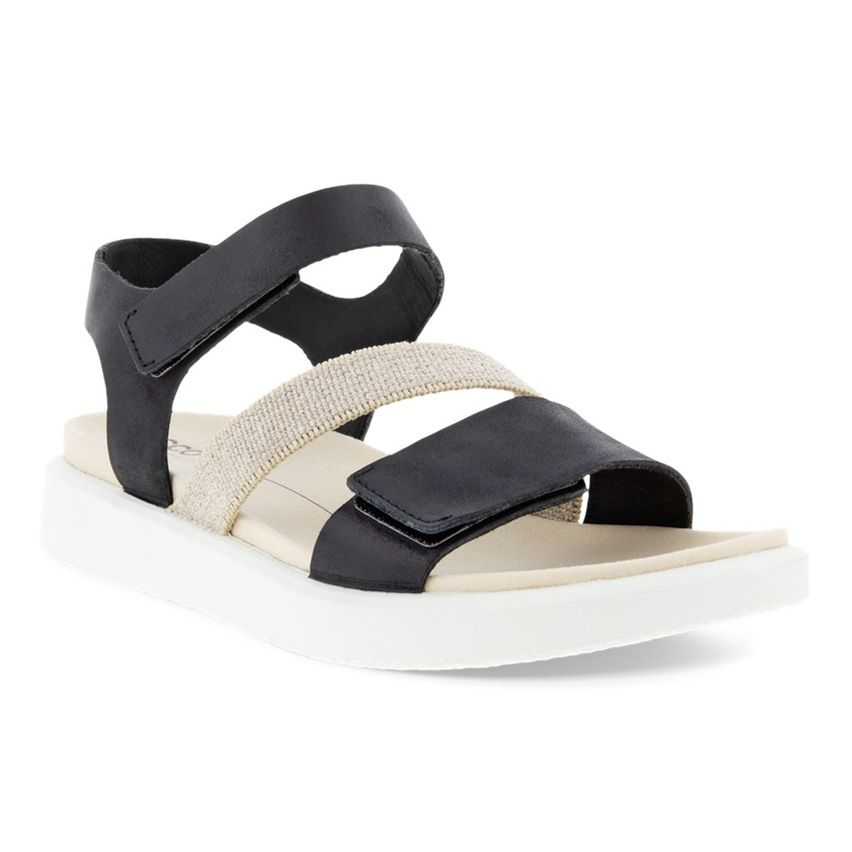 A black and beige ECCO FLOWT flat sandal with an adjustable toe strap and ankle strap, featuring a luxurious leather upper and a soft microfiber footbed.