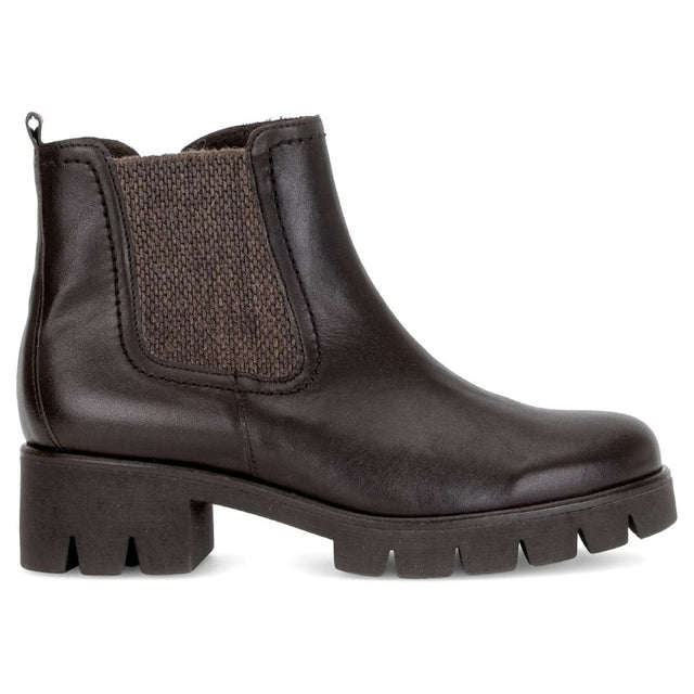Dark brown leather Chelsea boot with elastic side goring, heel pull tab, and heavy lugged block sole.