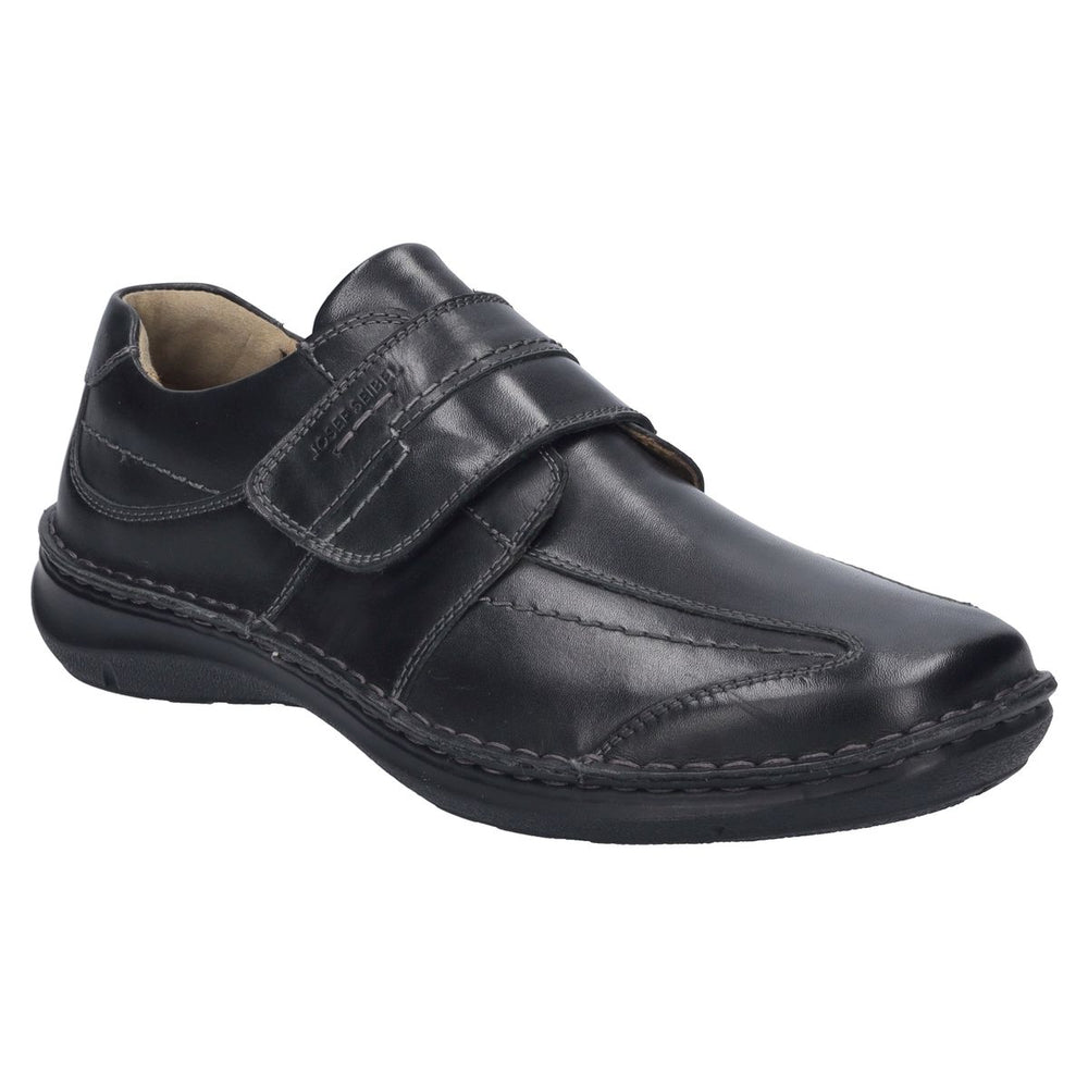 Men’s black leather slip-on shoe with wide fit, contrast stitching, elastic side panels, and removable insole. Built for comfort, support, and easy wear. Style #43360_370