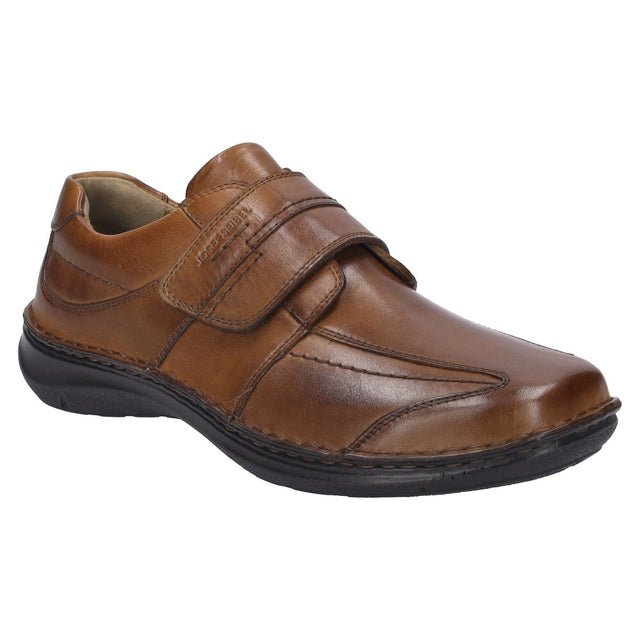 Men’s cognac leather slip-on shoe with wide fit, elastic side gores, contrast stitching, and removable insole. Lightweight, supportive, and orthotic-friendly. Style #44902-370