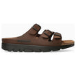 Unisex brown leather slide sandal with three adjustable straps, black buckles, and a thick black sole. Style #3451.