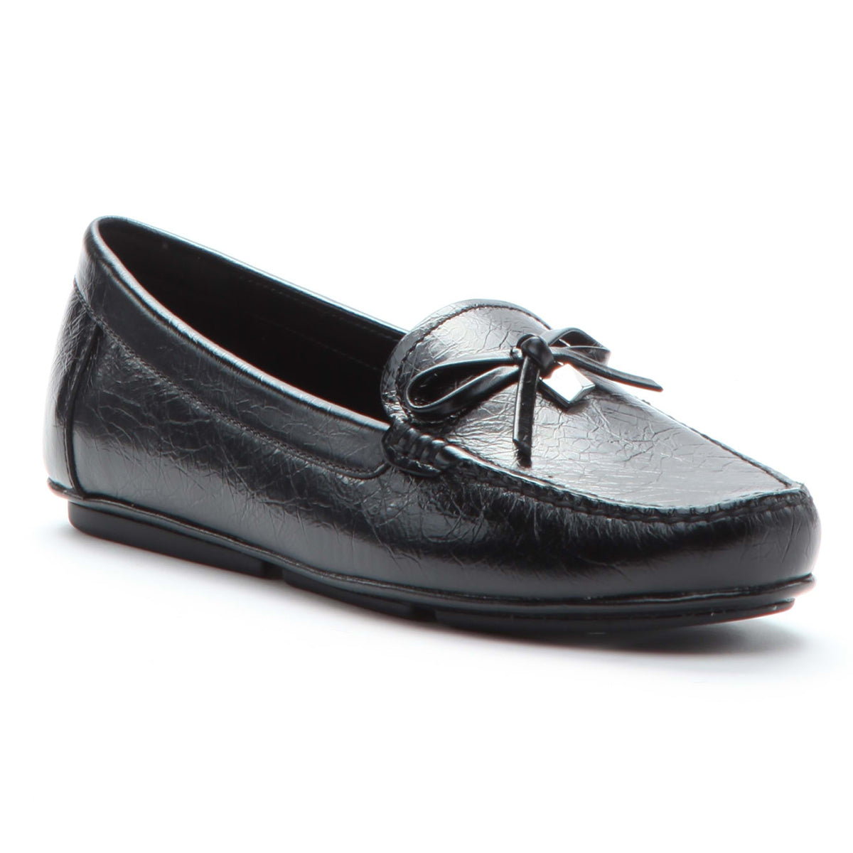 Black flat moccasin shoes with a leather bow detail on the vamp, featuring traditional contours and toebox stitching. Michael Kors Black Crush