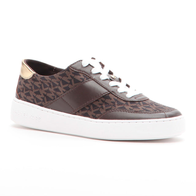 Brown Michael Kors lace-up sneaker with a signature logo print, gold heel detail, and white platform sole, 43T5KCFS5L