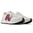 New Balance WS327JWC women’s runners in off-white suede with burgundy logo and black outsole, angled front-side view.