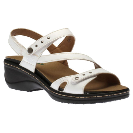 Women’s white leather multi-strap wedge sandal with metal stud details, a tan footbed, and a contoured black sole. Style #S8010.