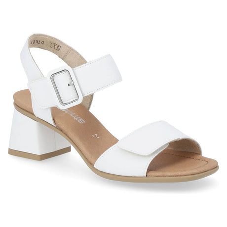 Women’s white leather sandal with adjustable velcro straps, a decorative silver buckle, and a tan block heel. Style #D1K51-80.