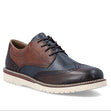 Men's blue and brown leather wingtip oxford shoe with lace closure and thick white outsole. Style #04504-25