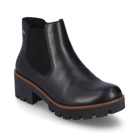 Rieker 79265 Women’s Black Chelsea Boots featuring smooth synthetic uppers, elastic side panels, short fur lining, and a 51mm block heel for stylish comfort.