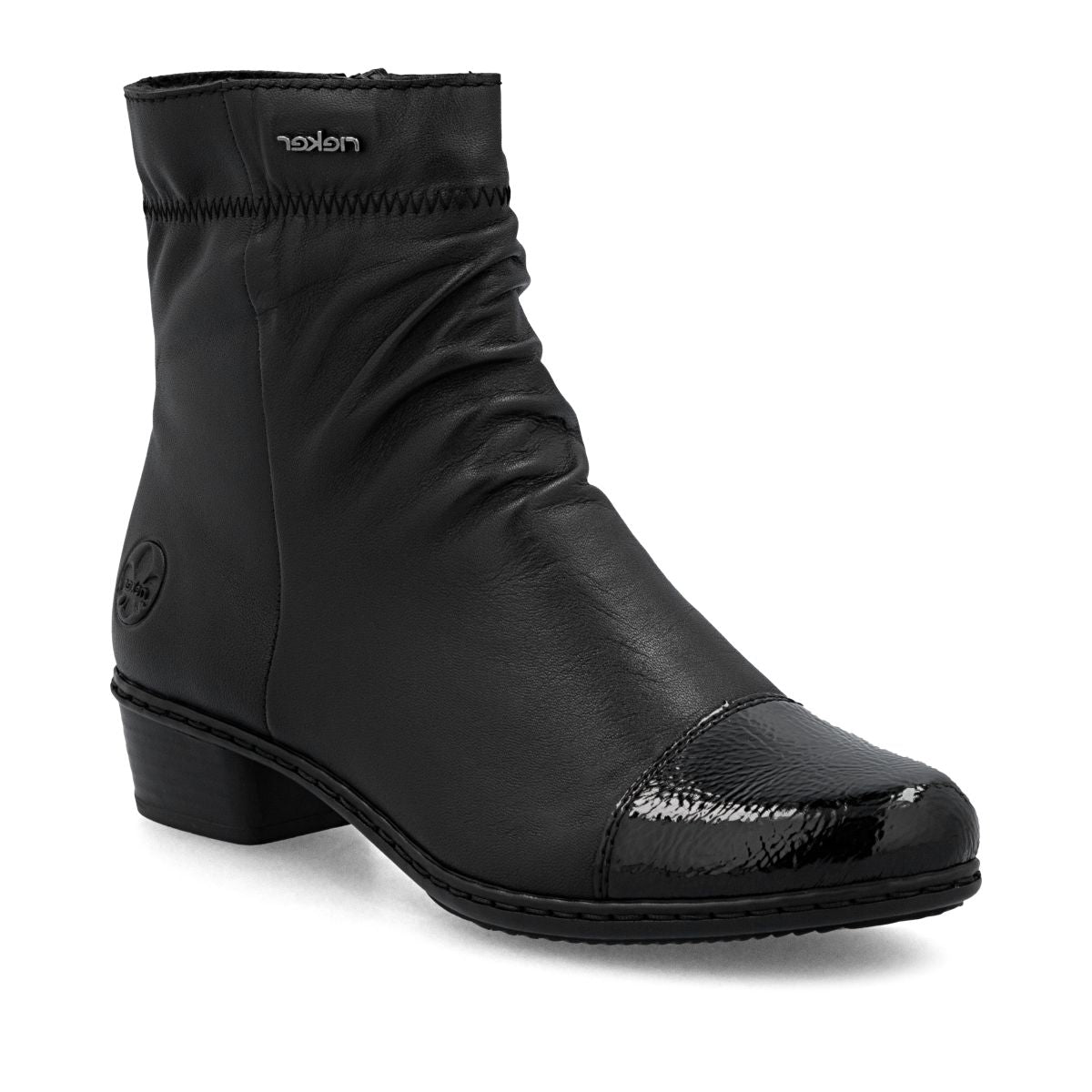 Black leather mid-height boot with ruched shaft, glossy patent toe cap, side zip, and low block heel. Style # Y0773-00