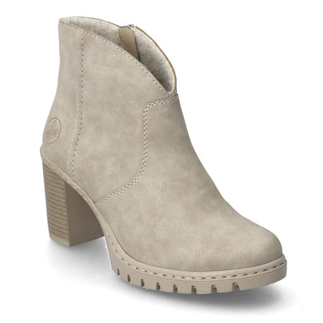 A beige ankle boot with a chunky heel and synthetic leather material, designed for the Fall/Winter season. Rieker Y2553-60