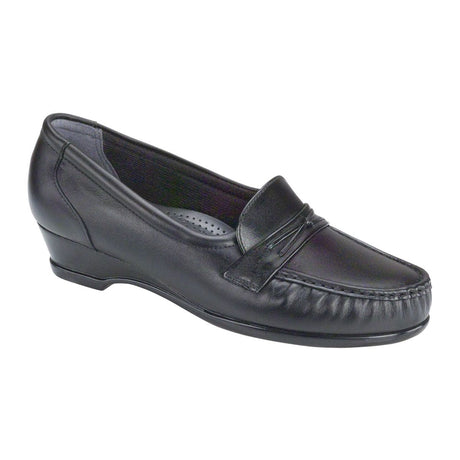 Black moccasin-style loafer with decorative saddle detail, cushioned TRIPAD® footbed, hidden elastic panels, and low wedge heel for ease and comfort. Style #0128-013