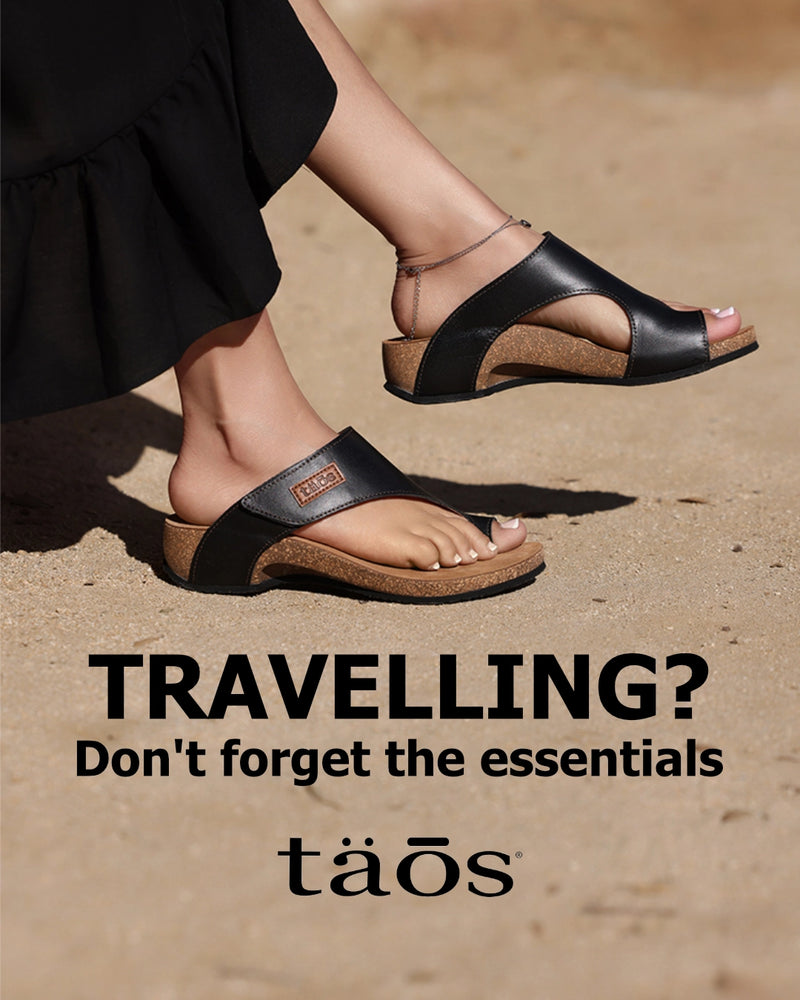 Person wearing black sandals with text promoting travel essentials by taos brand.