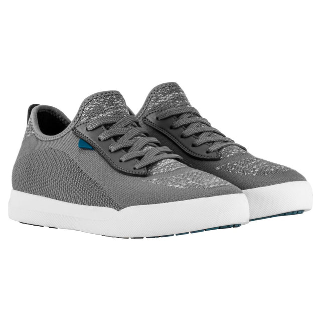Grey knit sneaker featuring integrated laces, a sock-like collar, and a thick, textured white sole. Style #F1005W-GY
