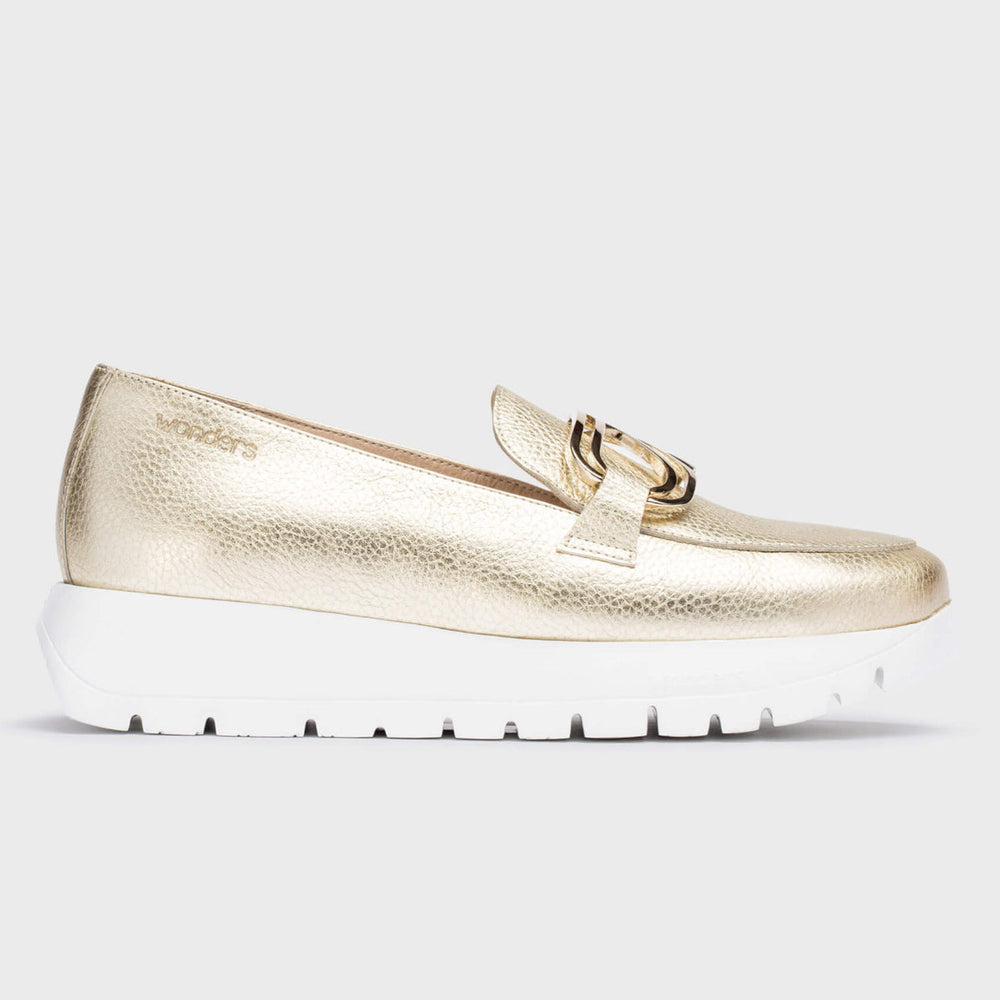 Metallic gold leather loafer with a thick flared platform sole, rounded toe, and elastic side panels for easy slip-on wear and bold modern style. Style #A2462-2235