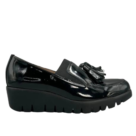Shiny black patent leather loafer with a sleek slip-on profile, cushioned removable insole, and a lightweight WondersFly™ sole for all-day stylish comfort. Style #3342